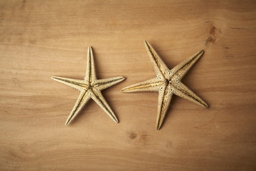 Fototapeta na wymiar starfishes on a wooden table