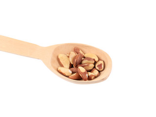 Wooden spoon with brazil nuts.