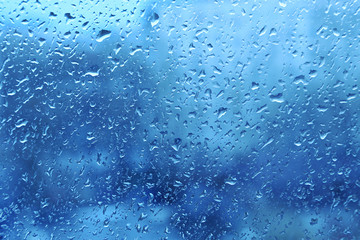 Natural water drops on window glass