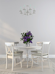 Shabby chairs and the dining table with a bouquet of lilacs