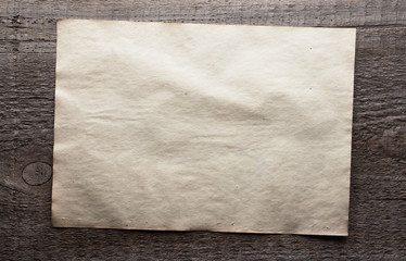 paper on wooden background