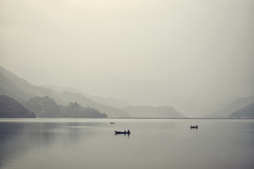 Fototapeta na wymiar Lake in a morning fog