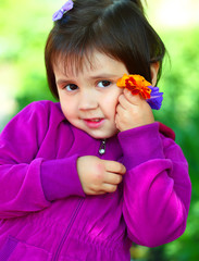 Beautiful smiling girl with a flower