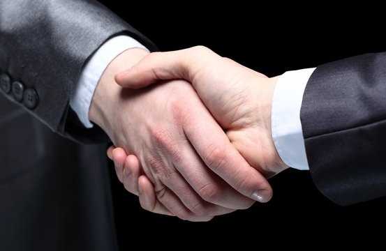 Close-up of business people shaking hands
