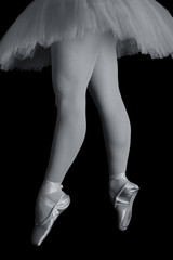 Ballet dancer standing on toes while dancing artistic converion