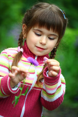 Beautiful smiling girl with a flower