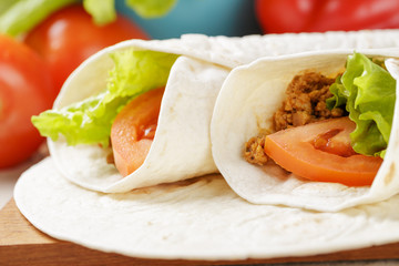 burritos with beef tomato and salad leaf