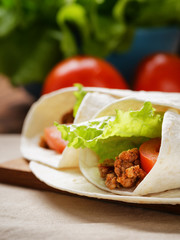 burritos with beef tomato and salad leaf