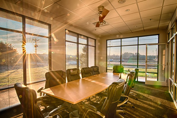 well lit conference room with sun rays shining through