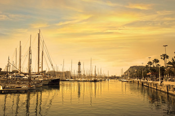 Fototapeta na wymiar Marina port with yachts in Barcelona at sunrise. Spain