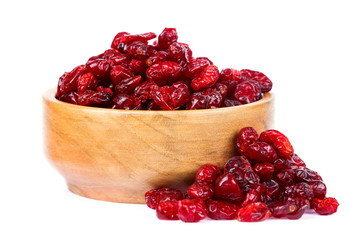 A bowl of dried cranberries on a white background