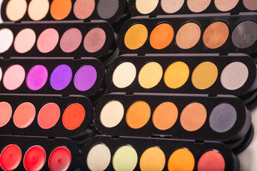 Cosmetics. Colorful eye shadows palette. Makeup background
