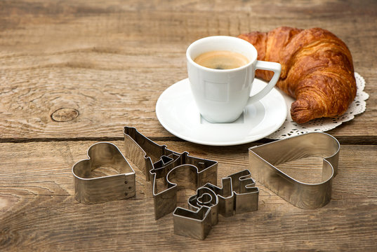 coffee with croissant and romatic decoration