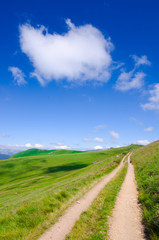 Dirt Road Under A Cloud In Blue Sky, Montenegro