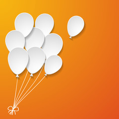 white paper balloons on the orange background