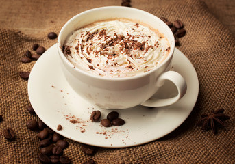 cappuccino on burlap background
