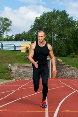 Obraz premium Image of muscle man running on stadium