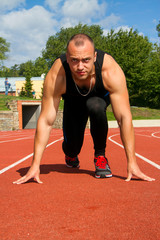 Image of muscle man ready to run