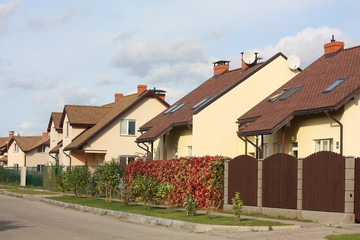 Fototapeta na wymiar Street with cottages in summer