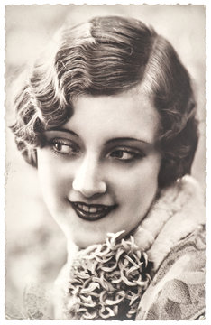 vintage portrait of young woman with flowers