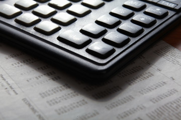 Closeup image of calculator keyboard on a document