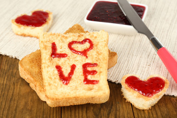 Delicious toast with jam  on table close-up