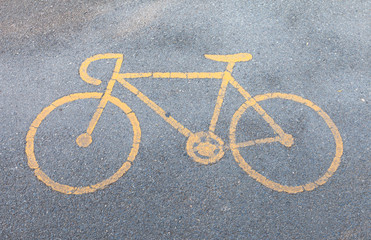 Obraz na płótnie Canvas yellow bicycle sign path on the road
