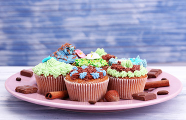Tasty cupcakes with butter cream,