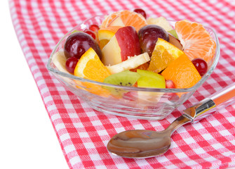 Sweet fresh fruits in bowl on table close-up
