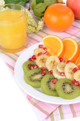 Sweet fresh fruits on plate on table close-up