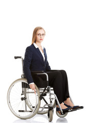 Obraz na płótnie Canvas Sad, serious business woman sitting on wheelchair.