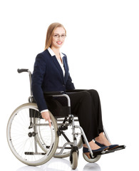 Obraz na płótnie Canvas Beautiful caucasain business woman sitting on wheelchair.
