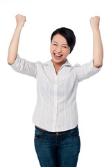 Excited charming girl with clenched fists