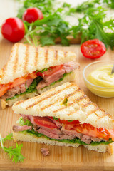 Panini closeup with roast beef and salad.