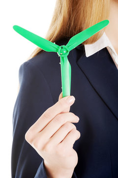 Beautiful caucasian business woman with green propeller.