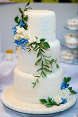 White wedding cake decorated with flowers