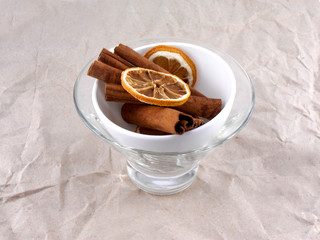 Cup with lemon and cinnamon bark