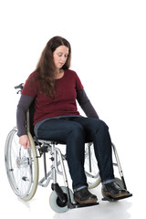 Obraz na płótnie Canvas Frau im Rollstuhl ist traurig