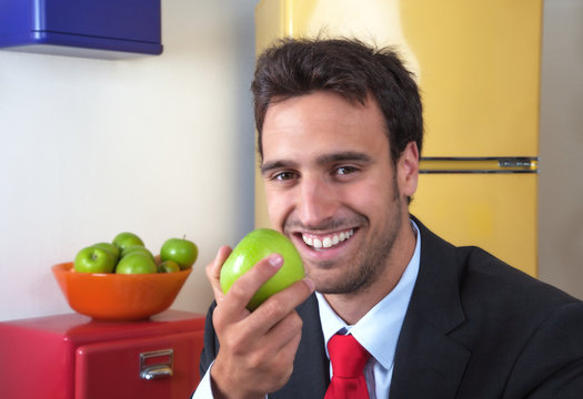 Attractive Latin Man Eating An Apple