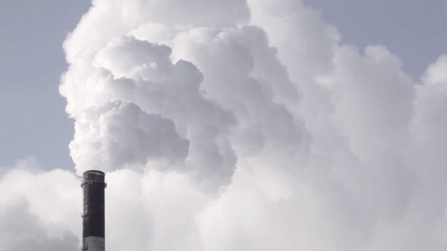 Heavy industry. Industrial smokestack pollute atmosphere.