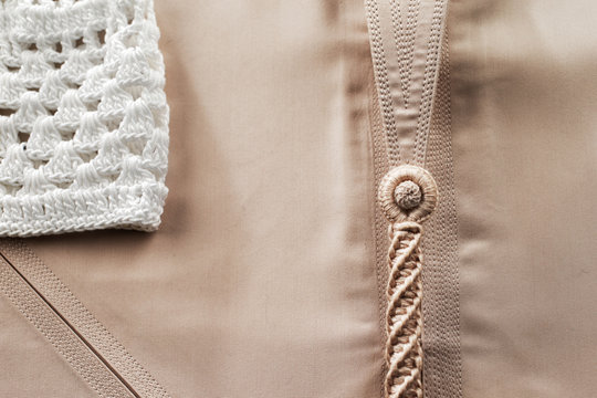 Detailed stitching of Kandura, the ankle-length garment