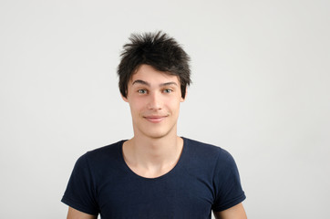 Portrait of a young man with crazy hair style. Bad hair cut day.