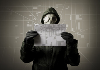 Gas mask and city map. Evacuation concept.