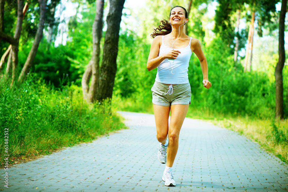 Wall mural Running Woman. Outdoor Workout in a Park. Full Length Portrait