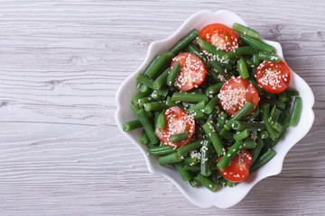 Salad of green beans and sesame seeds top view