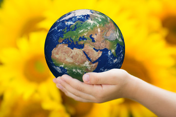 Child holding Earth in hands