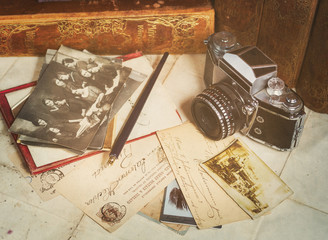 retro camera, old photos, letters and books with pen composition - 61490148