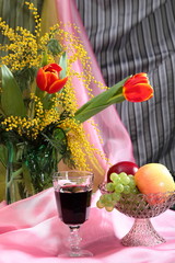 Still life with flowers, red wine and fruits