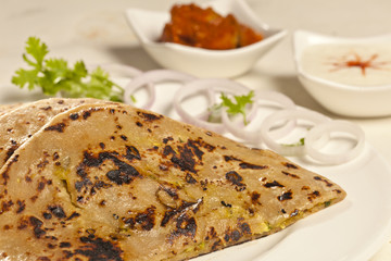 Hot delicious paratha with ghee.