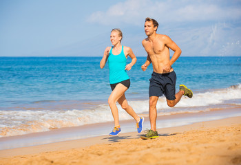 couple running on beach